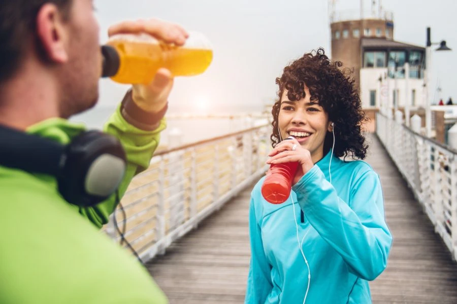 Active consumer drinking sports drink